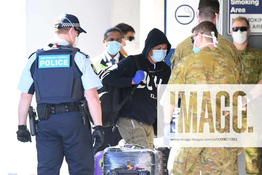 RUBY PRINCESS DEPARTURE, Crew from the Ruby Princess cruise ship are seen arriving at Sydney International Airport in Sydney, Thursday, April 23, 2020. The Ruby Princess cruise ship has been told to leave Australia by Thursday, as an inquiry begins. ( NO ARCHIVING, , NO USE IN BOOKS WITHOUT CONSENT SYDNEY NSW AUSTRALIA