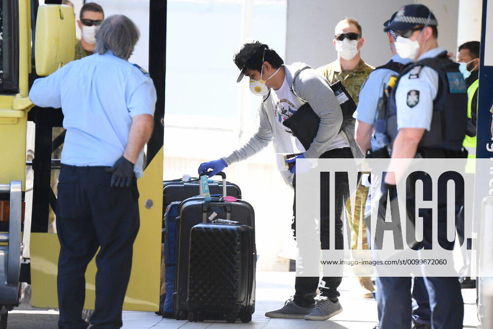 RUBY PRINCESS DEPARTURE, Crew from the Ruby Princess cruise ship are seen arriving at Sydney International Airport in Sydney, Thursday, April 23, 2020. The Ruby Princess cruise ship has been told to leave Australia by Thursday, as an inquiry begins. ( NO ARCHIVING, , NO USE IN BOOKS WITHOUT CONSENT SYDNEY NSW AUSTRALIA