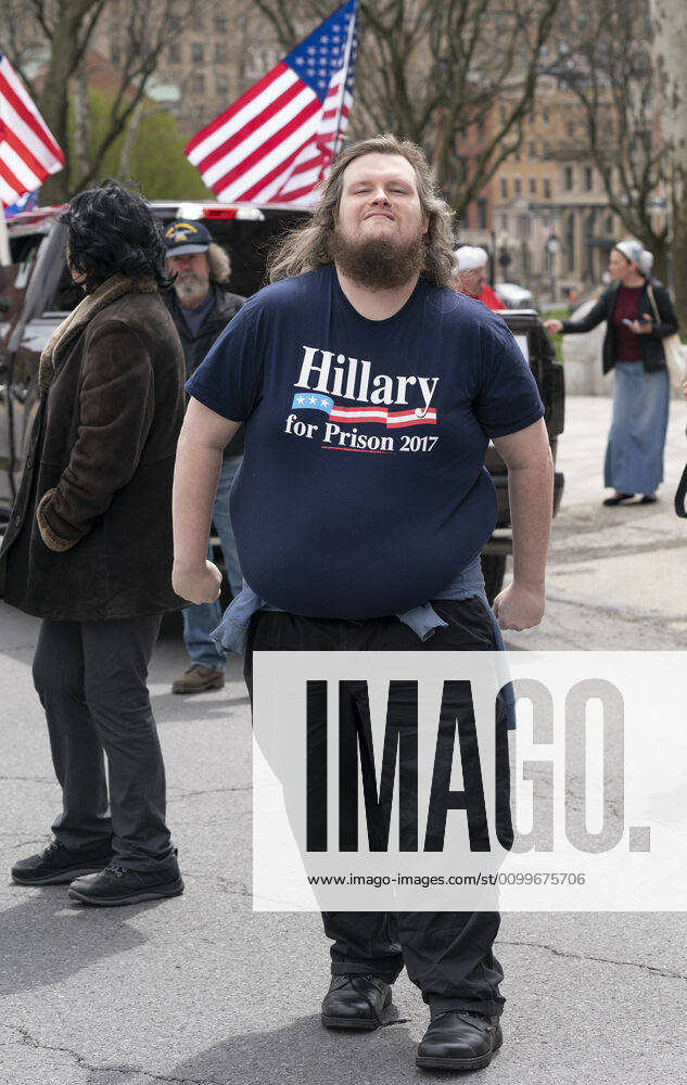 NY: Operation Gridlock in Albany A man wearing infowars.com t-shirt participates in Operation Gridlock protest outside of New York State Capitol Building. Participants demanded reopening of New York State. Many people on the street disregarded wearing facial masks and keep social distances. Albany New York United States