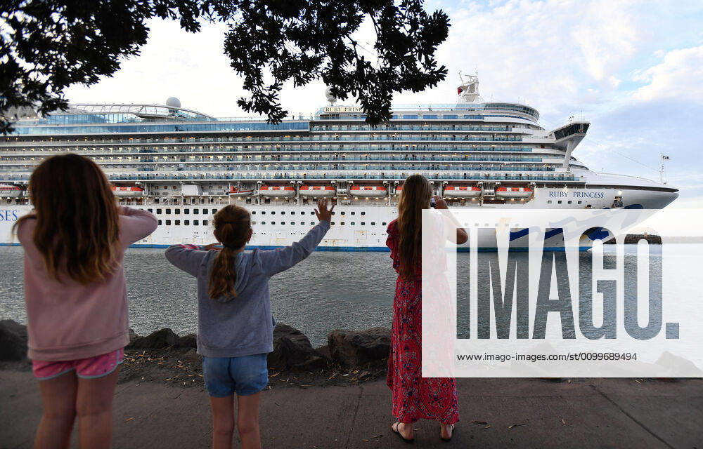 RUBY PRINCESS DEPARTURE, Residents wave farewell to crew onboard the Ruby Princess cruise ship as it departs Port Kembla in Wollongong, New South Wales, Thursday, April 23, 2020. The Ruby Princess cruise ship has been told to leave Australia by Thursday. ( NO ARCHIVING, , NO USE IN BOOKS WITHOUT CONSENT SYDNEY NSW AUSTRALIA