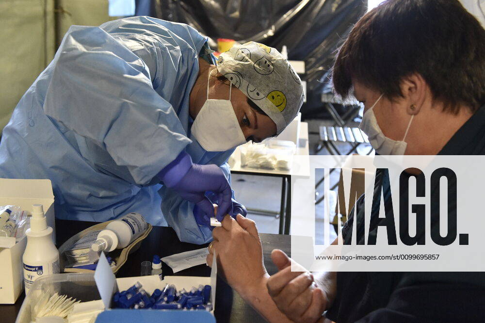 A medic takes a sample for a covid-19 test from a volunteer, on April 23, 2020, in Brno, Czech Republic. Across-the-board testing of population for new coronavirus began today. Test points open in Prague at 10:00, in Brno and Litomerice at 8:00. The goal is to find out the presence of coronavirus in Czech population. (CTKxPhoto VaclavxSalek) CTKPhotoP202004230170401 _SAL8235