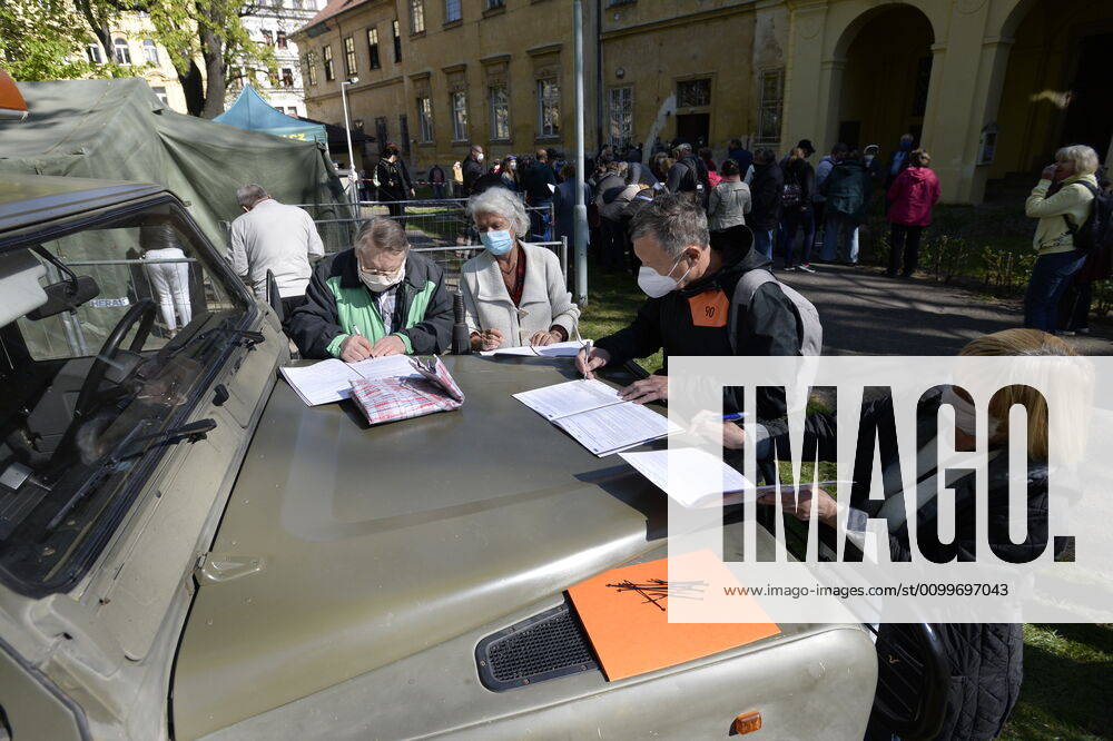 People fill out questionnaires to take a sample for a covid-19 test, on April 23, 2020, in Prague, Czech Republic. Across-the-board testing of population for new coronavirus began today. Test points open in Prague at 10:00, in Brno and Litomerice at 8:00. The goal is to find out the presence of coronavirus in Czech population. (CTKxPhoto KaterinaxSulova) CTKPhotoP202004230294601 _SUK6691
