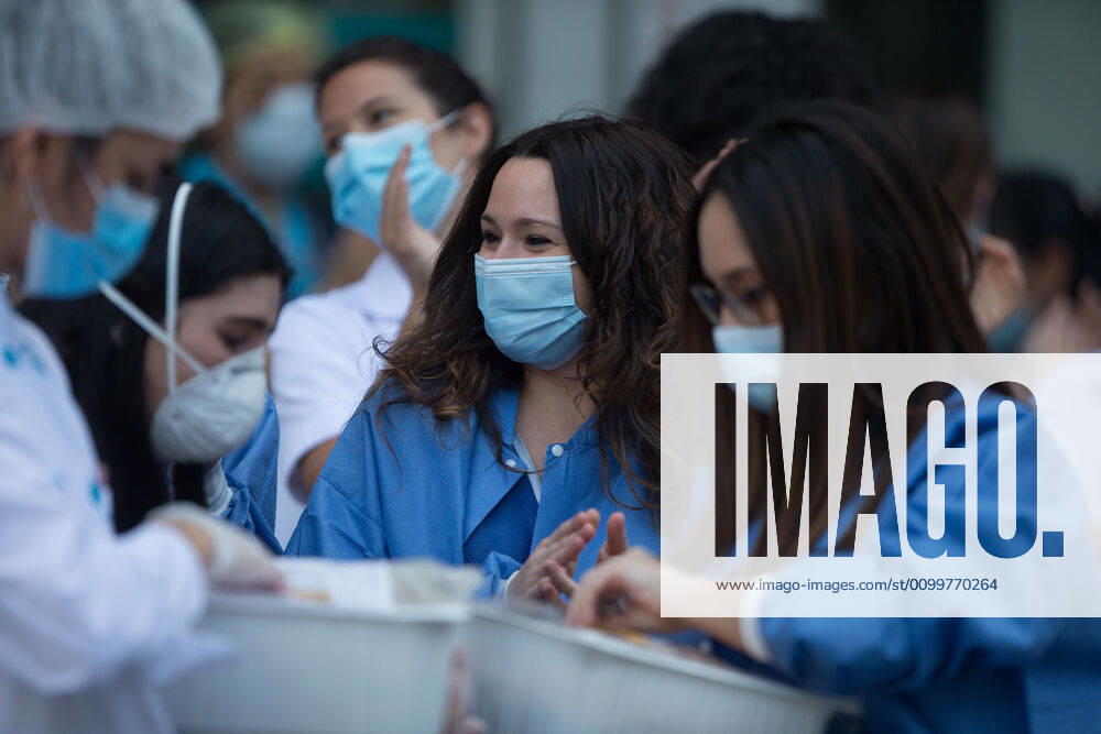 Municipal Police distributes biscuits to health during the tribute to the health workers at the Hospital Fundacion Jimenez Diaz during the Covid-19 pandemic on April 23, 2020 in Madrid, Spain Madrid SPAIN - ZUMAa181 20200423_zaa_a181_064