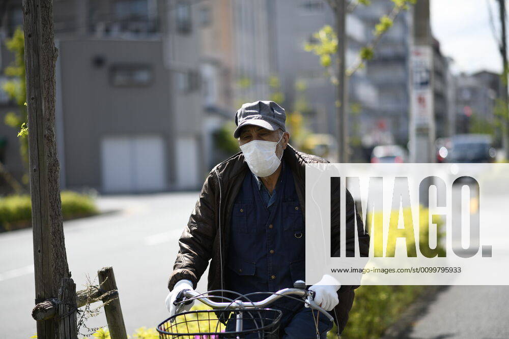 Coronavirus in Japan, Eindrücke aus Tokio TOKYO, JAPAN - APRIL 23: A man wearing face masks cycles along Kita Ayase amid the coronavirus pandemic on Thursday, April 23, 2020 in Tokyo, Japan. Japanese Prime Minister Shinzo Abe declared a nationwide State of Emergency last week requesting businesses including schools, athletic facilities, bars and restaurants to temporarily close or operate under reduced hours and urging people to stay home to stop spreading of the coronavirus throughout the country. (Photo: Richard Atrero de Guzman AFLO) (125658861)