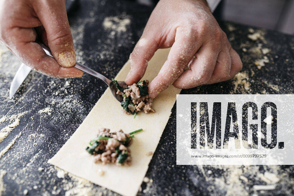 Close-up of man preparing homemade gluten free pasta model released Symbolfoto property released JRFF04307