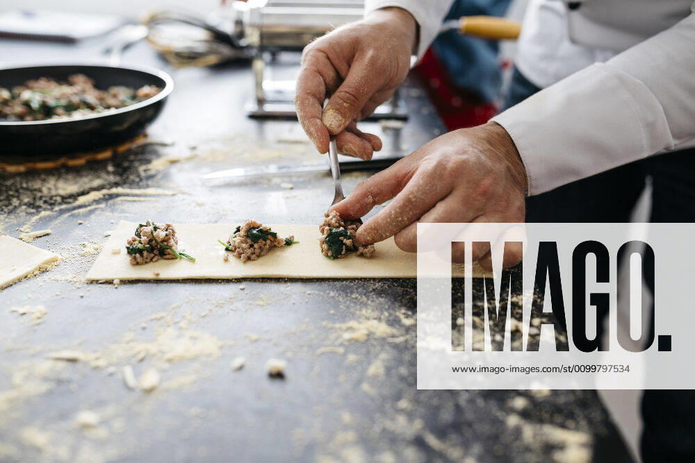 Close-up of man preparing homemade gluten free pasta model released Symbolfoto property released JRFF04308