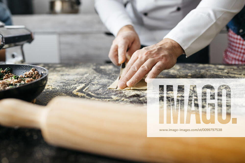 Close-up of man preparing homemade gluten free pasta model released Symbolfoto property released JRFF04309