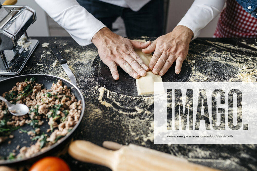 Close-up of man preparing homemade gluten free pasta model released Symbolfoto property released JRFF04311