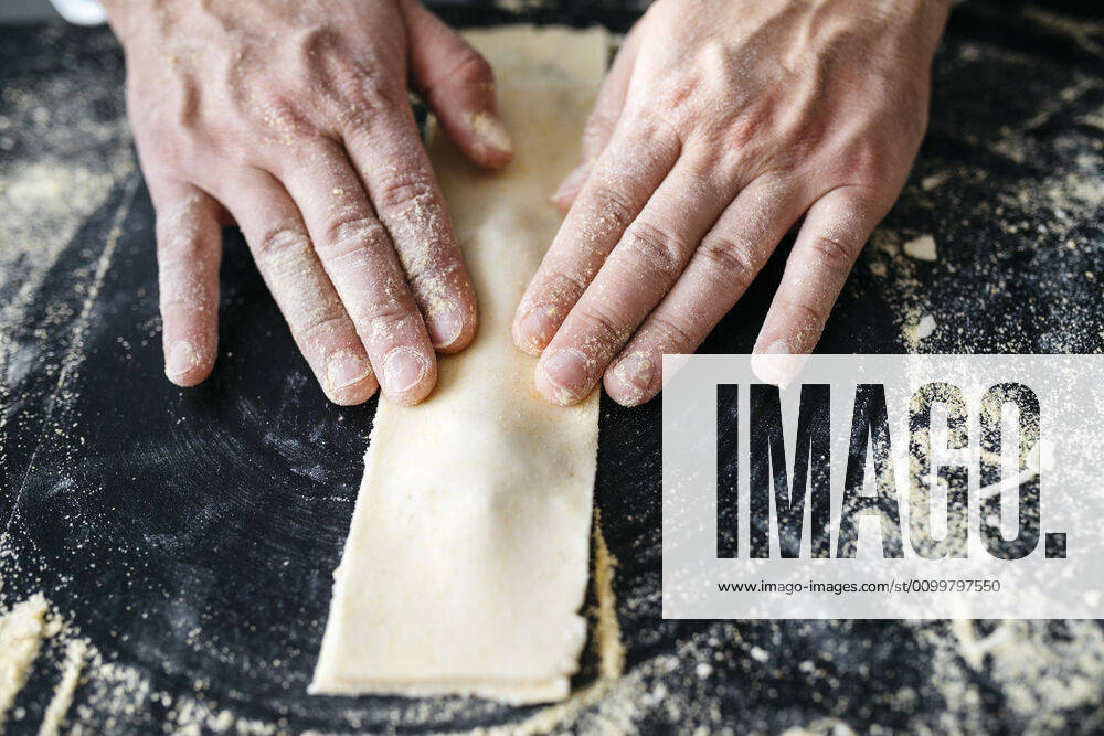 Close-up of man preparing homemade gluten free pasta model released Symbolfoto property released JRFF04312