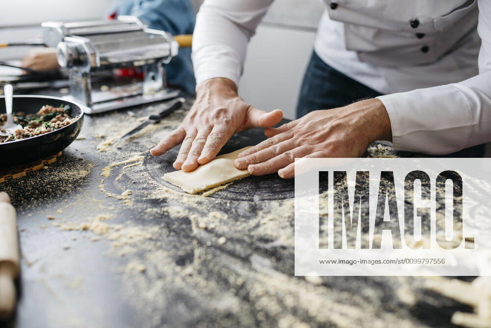 Close-up of man preparing homemade gluten free pasta model released Symbolfoto property released JRFF04313