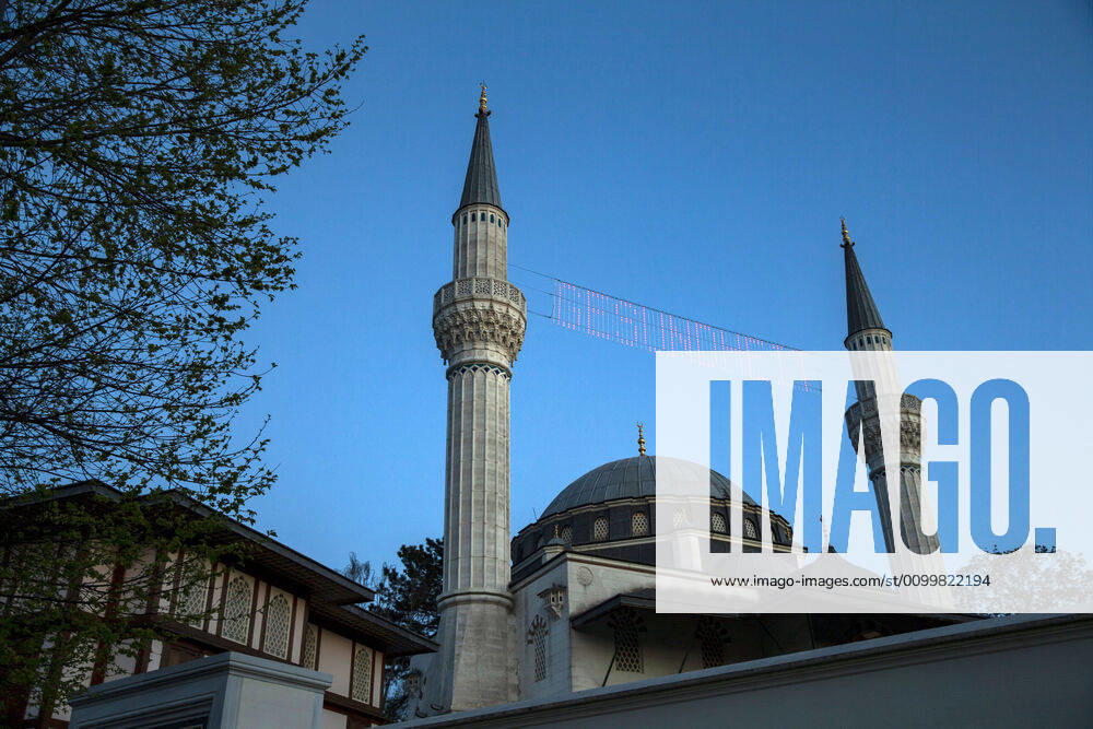 The writing Health shines between the minarets of the closed Sehitlik mosque in Berlin on 23 April 2020 Today begins the month of Ramadam Coronavirus in Berlin, which is holy for Islam