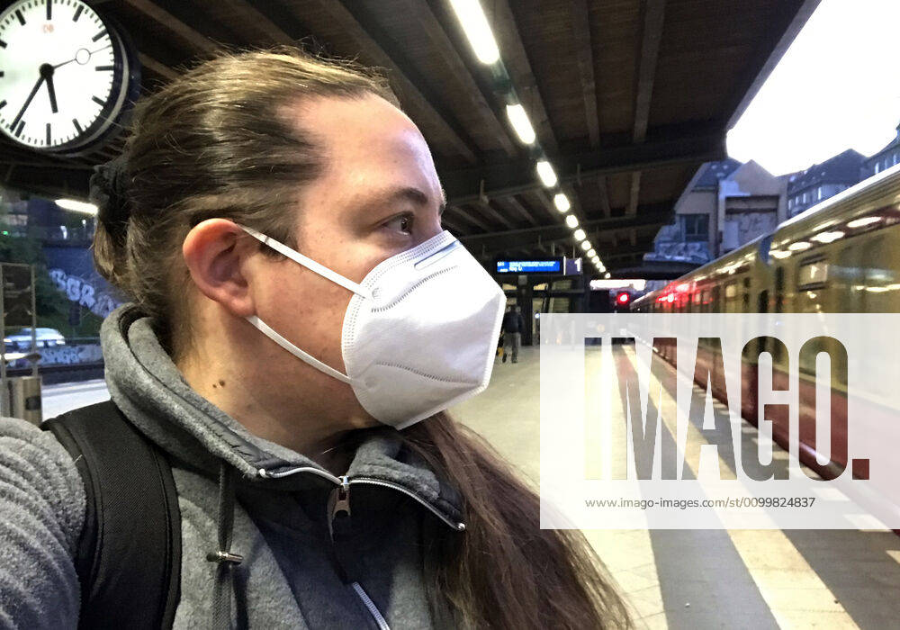 Berlin, GER Woman at a S train station wears a breathing mask in times of coro