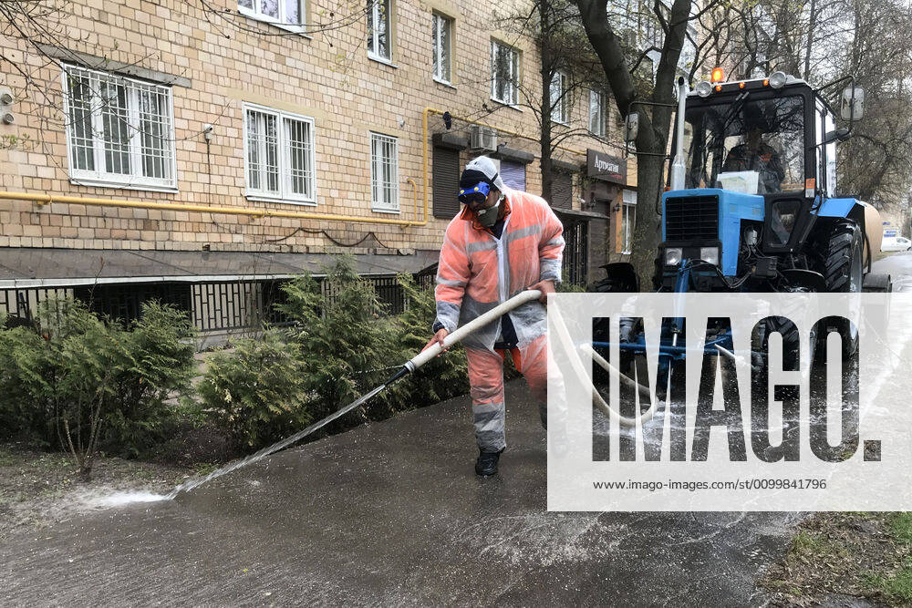 A utility worker washes with disinfectant pavements on Akademika Zelinskogo Street amid the ongoing COVID-19 pandemic. Mikhail Japaridze TASS TS0D6EEA