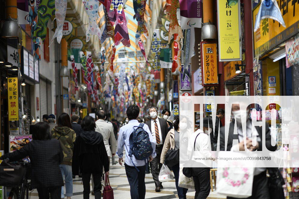 People wearing face masks is seen at Nakano shopping district amid the coronavirus outbreak on Friday, April 24, 2020 in Tokyo, Japan. Japanese Prime Minister Shinzo Abe declared a nationwide State of Emergency last week to stop the spreading of the coronavirus throughout the country. (Photo: Richard Atrero de Guzman AFLO) (125672623)