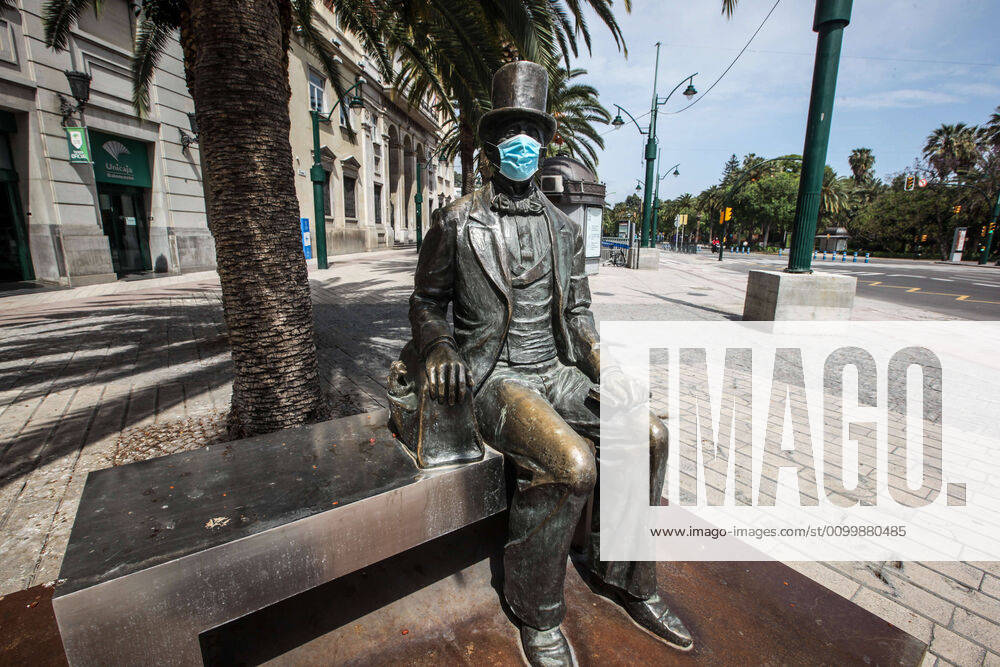 24 April 2020 (Malaga) The statue of Hans Christian Andersen is a sculpture located in Malaga in honour of the famous Danish writer who represents the writer sitting on a bench, in a relaxed attitude,The work is located in the Plaza de la Marina of the district Centre of Malaga has appeared with a mask during the crisis of the coronavirus - ZUMAc161 20200424_zap_c161_078