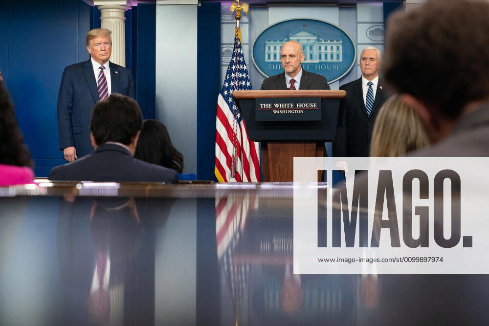 President Donald J. Trump and Vice President Mike Pence listen as Commissioner of Food and Drugs Dr. Stephen Hahn delivers remarks during a coronavirus update briefing Friday, April 24, 2020, in the James S. Brady Press Briefing Room of the White House..People: Dr. Stephen Hahn Washington United States Of America - ZUMAs214 20200424_zaa_s214_001