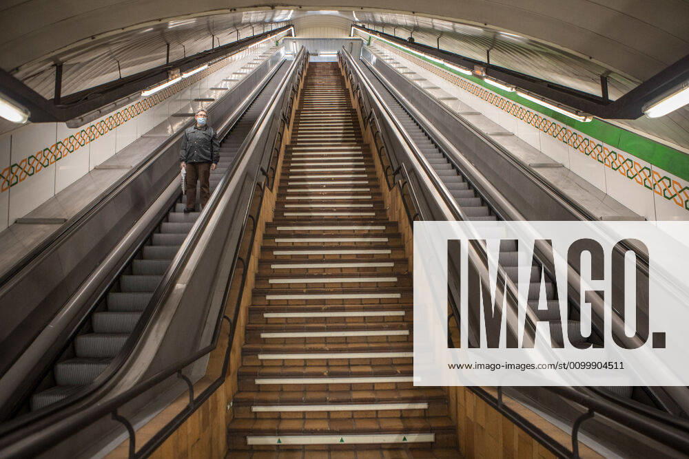 A man using the empty access escalators of the Madrid Metro Station during the covid 19 crisis..Day 41 of the state of alarm due to the Coronavirus health crisis. Spain has had more than 200,000 confirmed cases of COVID-19 and over 20,000 reported deaths. Daily deaths from coronavirus have dropped in the last 24 hours to 367, the lowest rate in a month. Madrid Spain - ZUMAs197 20200424_zaa_s197_213
