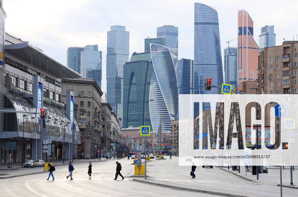 People cross a deserted Bolshaya Dorogomilovskaya Street in central Moscow during the pandemic of the novel coronavirus disease (COVID-19). Seen in the distance are skyscrapers of the Moscow International Business Centre (MIBC). On 13 April 2020, the Moscow government introduced a digital permit system aimed at further restricting movement. Under the new scheme, which became mandatory on 15 April, people need to apply for permits to travel on a vehicle or public transport around the city. As of 24 April 2020, Russia has reported more than 68,700 confirmed cases of the novel coronavirus infection, with more than 36,800 confirmed cases in Moscow. Marina Lystseva TASS TS0D702F