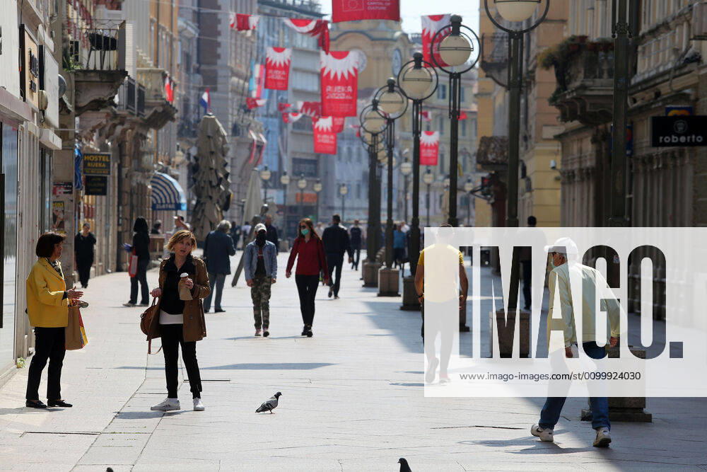 As traders prepare window displays to open, citizens stroll through Korzo 25.04.2020., Croatia, Rijeka - Numerous citizens walked through Korzo. Shops are setting up shop windows ahead of opening next week. GoranxKovacic PIXSELL