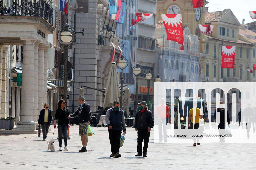 As traders prepare window displays to open, citizens stroll through Korzo 25.04.2020., Croatia, Rijeka - Numerous citizens walked through Korzo. Shops are setting up shop windows ahead of opening next week. GoranxKovacic PIXSELL