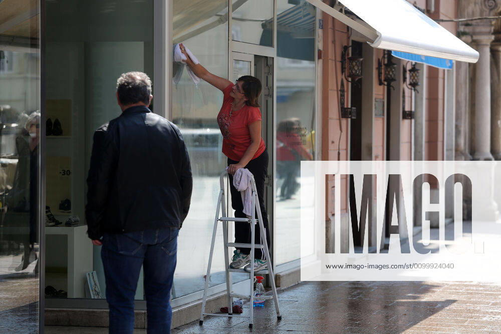 As traders prepare window displays to open, citizens stroll through Korzo 25.04.2020., Croatia, Rijeka - Numerous citizens walked through Korzo. Shops are setting up shop windows ahead of opening next week. GoranxKovacic PIXSELL
