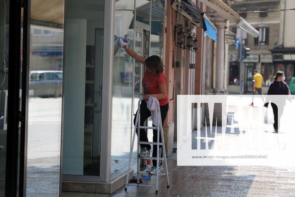 As traders prepare window displays to open, citizens stroll through Korzo 25.04.2020., Croatia, Rijeka - Numerous citizens walked through Korzo. Shops are setting up shop windows ahead of opening next week. GoranxKovacic PIXSELL