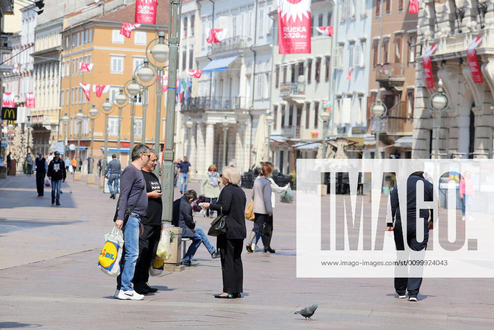 As traders prepare window displays to open, citizens stroll through Korzo 25.04.2020., Croatia, Rijeka - Numerous citizens walked through Korzo. Shops are setting up shop windows ahead of opening next week. GoranxKovacic PIXSELL