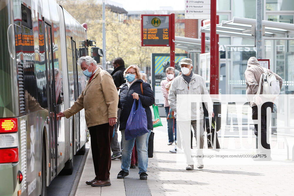 Consequences of the Corona Virus in Wolfsburg, passengers board a bus with masks In Wolfsburg, it is mandatory to wear a mask in all shops and on buses, covering mouth and nose Wolfsburg
