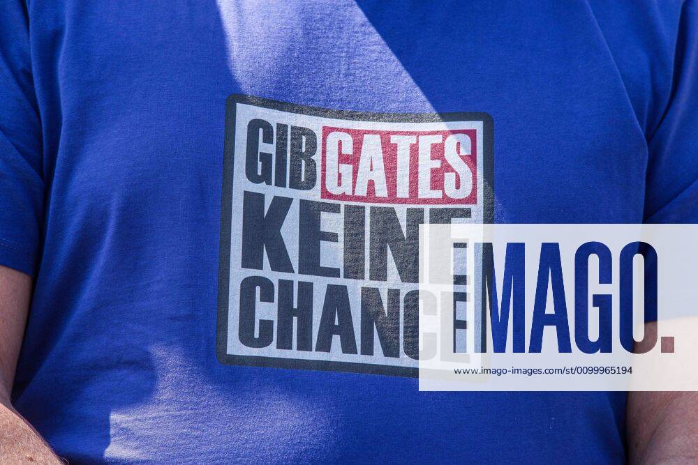 Don t give Bill Gates a chance worn at a QAnon-like demo in Munich, Germany. Organized in Telegram chats by conspiratorial â€oeQuerfront†(cross-front) groups, the city of Munich, Germany saw numerous QAnon-like, â€oeCorona Parties†as under mottos such as â€oeDemonstration fuer die Erhaltung der Grundrechte†(Demonstration for the Upholding of Basic Rights) and â€oeFuer unsere Freiheit, unsere Grundrechte und unsere Selbstbestimmung†(Demonstration for our Freedom, Basic Rights, and Self-Determination). Numerous right-extremists, Verfassungsschutz-monitored figures, QAnon fans, and AfD politicians were in attendance. The groups are of the belief that the anti-Coronavirus measures are power-grabs. Querfront groups are often a mix of political outliers, - ZUMAb160 20200425_zbp_b160_002