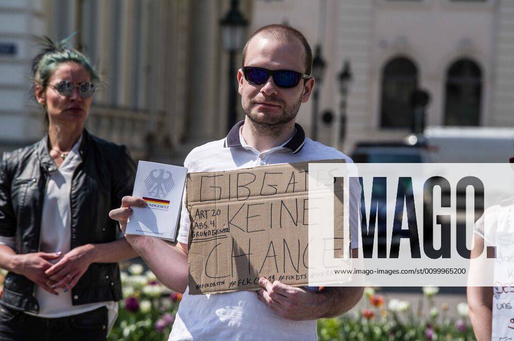 Don t give Bill Gates a chance worn at a QAnon-like demo in Munich, Germany. Organized in Telegram chats by conspiratorial Ã¢â‚¬oeQuerfrontÃ¢â‚¬Â (cross-front) groups, the city of Munich, Germany saw numerous QAnon-like, Ã¢â‚¬oeCorona PartiesÃ¢â‚¬Â as under mottos such as Ã¢â‚¬oeDemonstration fuer die Erhaltung der GrundrechteÃ¢â‚¬Â (Demonstration for the Upholding of Basic Rights) and Ã¢â‚¬oeFuer unsere Freiheit, unsere Grundrechte und unsere SelbstbestimmungÃ¢â‚¬Â (Demonstration for our Freedom, Basic Rights, and Self-Determination). Numerous right-extremists, Verfassungsschutz-monitored figures, QAnon fans, and AfD politicians were in attendance. The groups are of the belief that the anti-Coronavirus measures are power-grabs. Querfront groups are often a mix of political outliers, - ZUMAb160 20200425_zbp_b160_004