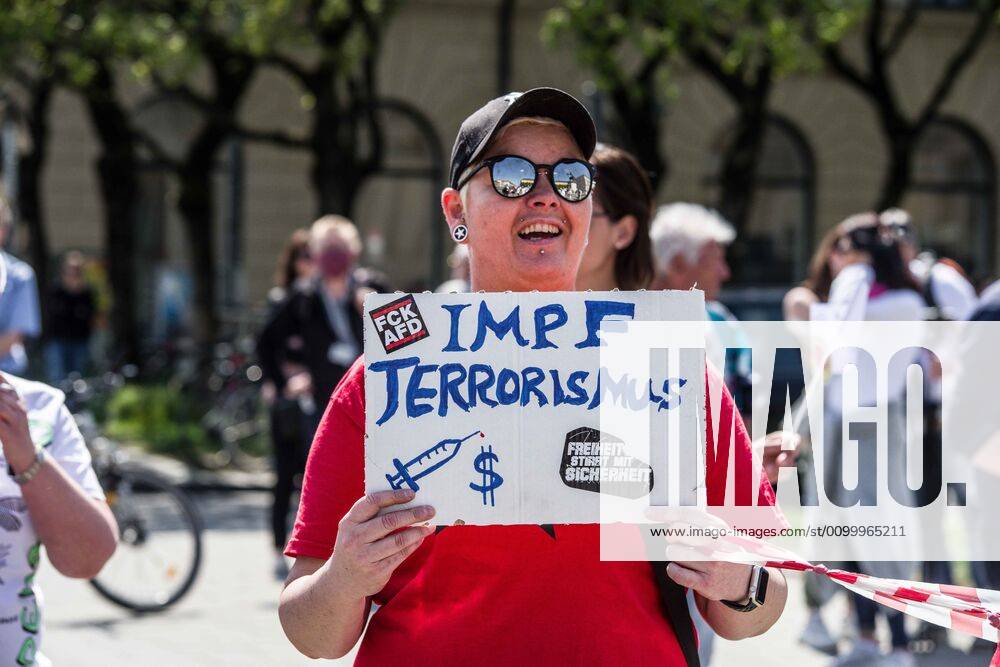 Vaccine terrorism displayed at a QAnon-like demo in Munich, Germany. Organized in Telegram chats by conspiratorial Ã¢â‚¬oeQuerfrontÃ¢â‚¬Â (cross-front) groups, the city of Munich, Germany saw numerous QAnon-like, Ã¢â‚¬oeCorona PartiesÃ¢â‚¬Â as under mottos such as Ã¢â‚¬oeDemonstration fuer die Erhaltung der GrundrechteÃ¢â‚¬Â (Demonstration for the Upholding of Basic Rights) and Ã¢â‚¬oeFuer unsere Freiheit, unsere Grundrechte und unsere SelbstbestimmungÃ¢â‚¬Â (Demonstration for our Freedom, Basic Rights, and Self-Determination). Numerous right-extremists, Verfassungsschutz-monitored figures, QAnon fans, and AfD politicians were in attendance. The groups are of the belief that the anti-Coronavirus measures are power-grabs. Querfront groups are often a mix of political outliers, AfD mem - ZUMAb160 20200425_zbp_b160_007