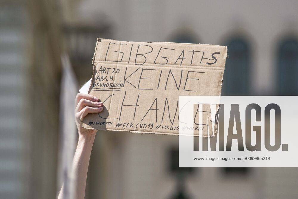 Don t give Bill Gates a chance at a QAnon-like demo in Munich, Germany. Organized in Telegram chats by conspiratorial â€oeQuerfront†(cross-front) groups, the city of Munich, Germany saw numerous QAnon-like, â€oeCorona Parties†as under mottos such as â€oeDemonstration fuer die Erhaltung der Grundrechte†(Demonstration for the Upholding of Basic Rights) and â€oeFuer unsere Freiheit, unsere Grundrechte und unsere Selbstbestimmung†(Demonstration for our Freedom, Basic Rights, and Self-Determination). Numerous right-extremists, Verfassungsschutz-monitored figures, QAnon fans, and AfD politicians were in attendance. The groups are of the belief that the anti-Coronavirus measures are power-grabs. Querfront groups are often a mix of political outliers, AfD - ZUMAb160 20200425_zbp_b160_009