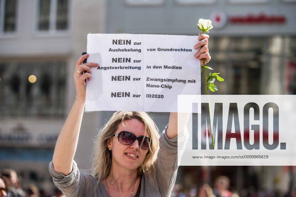 A demonstrator at a conspiracy theorist demo in Munich, Germany holds a sign opposing vaccines, alleged ID chips in vaccines, ID2020, and other topics. Organized in Telegram chats by conspiratorial â€oeQuerfront†(cross-front) groups, the city of Munich, Germany saw numerous anti-state â€oeCorona Parties†as under mottos such as â€oeDemonstration fuer die Erhaltung der Grundrechte†(Demonstration for the Upholding of Basic Rights) and â€oeFuer unsere Freiheit, unsere Grundrechte und unsere Selbstbestimmung†(Demonstration for our Freedom, Basic Rights, and Self-Determination). Numerous right-extremists, Verfassungsschutz-monitored figures, QAnon fans, and AfD politicians were in attendance. The groups are of the belief that the anti-Coronavirus measures are- ZUMAb160 20200425_zbp_b160_025