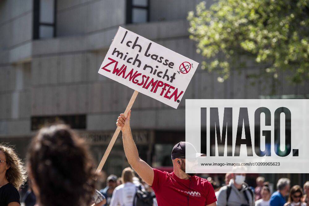 An anti-vaxxer holds a sign opposing vaccines at a conspiracy demonstration in Munich, Germany. Organized in Telegram chats by conspiratorial Ã¢â‚¬oeQuerfrontÃ¢â‚¬Â (cross-front) groups, the city of Munich, Germany saw numerous anti-state Ã¢â‚¬oeCorona PartiesÃ¢â‚¬Â as under mottos such as Ã¢â‚¬oeDemonstration fuer die Erhaltung der GrundrechteÃ¢â‚¬Â (Demonstration for the Upholding of Basic Rights) and Ã¢â‚¬oeFuer unsere Freiheit, unsere Grundrechte und unsere SelbstbestimmungÃ¢â‚¬Â (Demonstration for our Freedom, Basic Rights, and Self-Determination). Numerous right-extremists, Verfassungsschutz-monitored figures, QAnon fans, and AfD politicians were in attendance. The groups are of the belief that the anti-Coronavirus measures are power-grabs. Querfront groups are often a mix of politic - ZUMAb160 20200425_zbp_b160_026