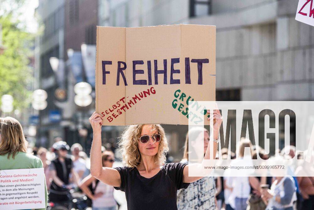 Freedom..Self-determinations, basic rights held during a QAnon-like demo in Munich, Germany. Organized in Telegram chats by conspiratorial Ã¢â‚¬oeQuerfrontÃ¢â‚¬Â (cross-front) groups, the city of Munich, Germany saw numerous anti-state Ã¢â‚¬oeCorona PartiesÃ¢â‚¬Â as under mottos such as Ã¢â‚¬oeDemonstration fuer die Erhaltung der GrundrechteÃ¢â‚¬Â (Demonstration for the Upholding of Basic Rights) and Ã¢â‚¬oeFuer unsere Freiheit, unsere Grundrechte und unsere SelbstbestimmungÃ¢â‚¬Â (Demonstration for our Freedom, Basic Rights, and Self-Determination). Numerous right-extremists, Verfassungsschutz-monitored figures, QAnon fans, and AfD politicians were in attendance. The groups are of the belief that the anti-Coronavirus measures are power-grabs. Querfront groups are often a mix of polit - ZUMAb160 20200425_zbp_b160_029