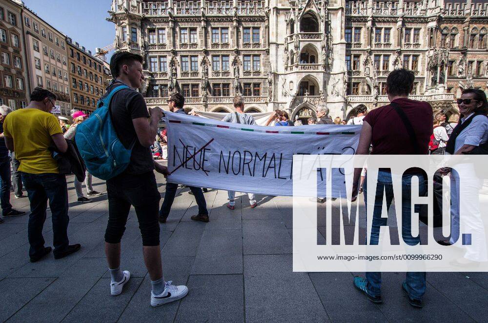 The New Normal? displayed during a QAnon-like demo in Munich, Germany. Organized in Telegram chats by conspiratorial â€oeQuerfront†(cross-front) groups, the city of Munich, Germany saw numerous anti-state â€oeCorona Parties†as under mottos such as â€oeDemonstration fuer die Erhaltung der Grundrechte†(Demonstration for the Upholding of Basic Rights) and â€oeFuer unsere Freiheit, unsere Grundrechte und unsere Selbstbestimmung†(Demonstration for our Freedom, Basic Rights, and Self-Determination). Numerous right-extremists, Verfassungsschutz-monitored figures, QAnon fans, and AfD politicians were in attendance. The groups are of the belief that the anti-Coronavirus measures are power-grabs. Querfront groups are often a mix of political outliers, AfD me - ZUMAb160 20200425_zbp_b160_065