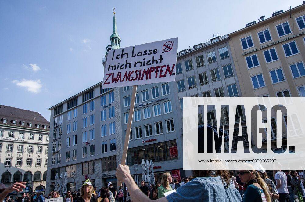 An anti-vaxxer displays a sign opposing vaccines at a QAnon-like demo in Munich, Germany. Organized in Telegram chats by conspiratorial â€oeQuerfront†(cross-front) groups, the city of Munich, Germany saw numerous anti-state â€oeCorona Parties†as under mottos such as â€oeDemonstration fuer die Erhaltung der Grundrechte†(Demonstration for the Upholding of Basic Rights) and â€oeFuer unsere Freiheit, unsere Grundrechte und unsere Selbstbestimmung†(Demonstration for our Freedom, Basic Rights, and Self-Determination). Numerous right-extremists, Verfassungsschutz-monitored figures, QAnon fans, and AfD politicians were in attendance. The groups are of the belief that the anti-Coronavirus measures are power-grabs. Querfront groups are often a mix of political ou - ZUMAb160 20200425_zbp_b160_068