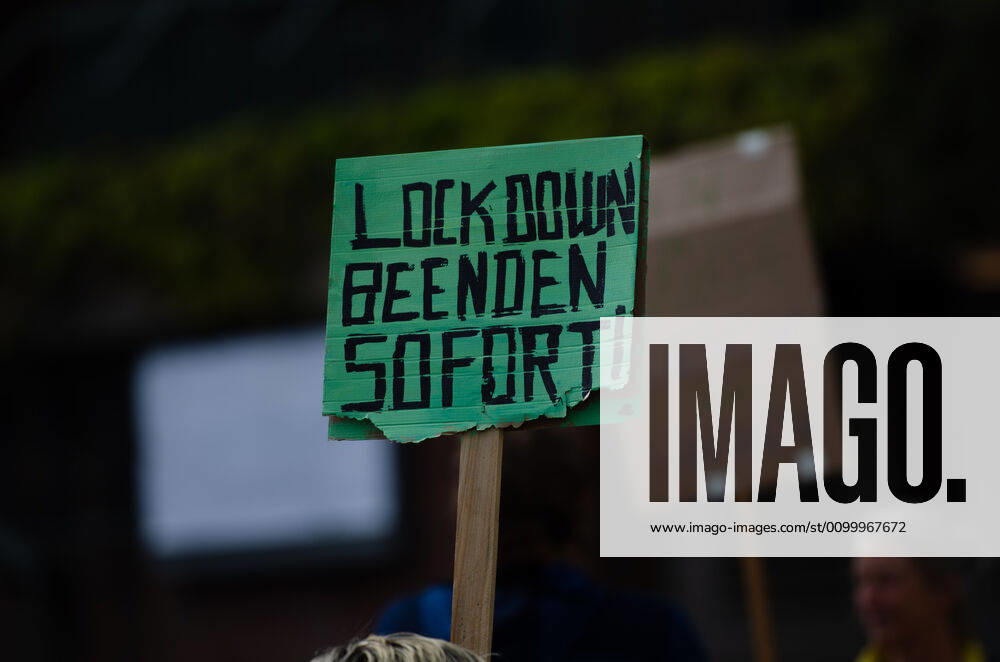 Stop lockdown immediately Demonstration on Südermarkt in Flensburg The Communication Centre for Democratic Resistance is organising a demonstration on 25 04 2020 in Flensburg on Südermarkt, city centre Demonstrator is holding a banner with the words Stop lockdown immediately