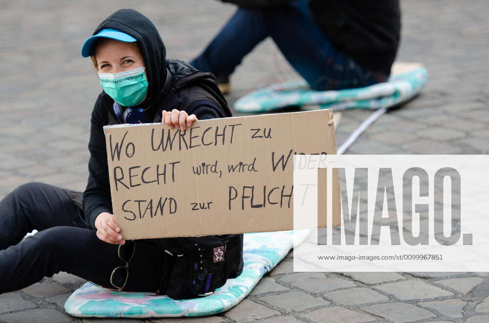 Lockdown end immediately Demonstration on Südermarkt in Flensburg The Communication Centre for Democratic Resistance is organising a demonstration on 25 04 2020 in Flensburg on Südermarkt, Innenstadt Woman holding banner Where injustice becomes right, resistance becomes a duty