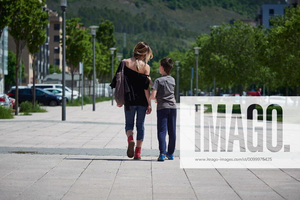 A woman walks with a child during the Covid-19 pandemic on April 25, 2020 in Pamplona, Spain Pamplona SPAIN - ZUMAa181 20200425_zaa_a181_005