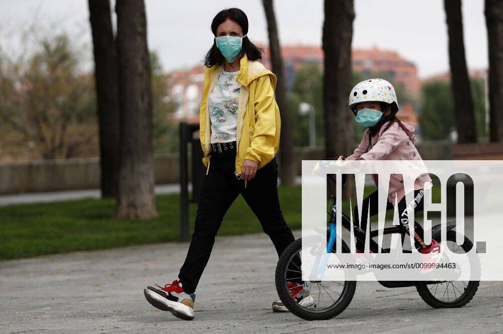 A girl rides a bicycle in Madrid, Spain, 26 April 2020, on the first day minors are allowed an hour a day walk since lockdown was ordered in Spain 44 days ago in an attempt to flatten the coronavirus curve. Minors allowed an hour a day walk during lockdown !ACHTUNG: NUR REDAKTIONELLE NUTZUNG!
