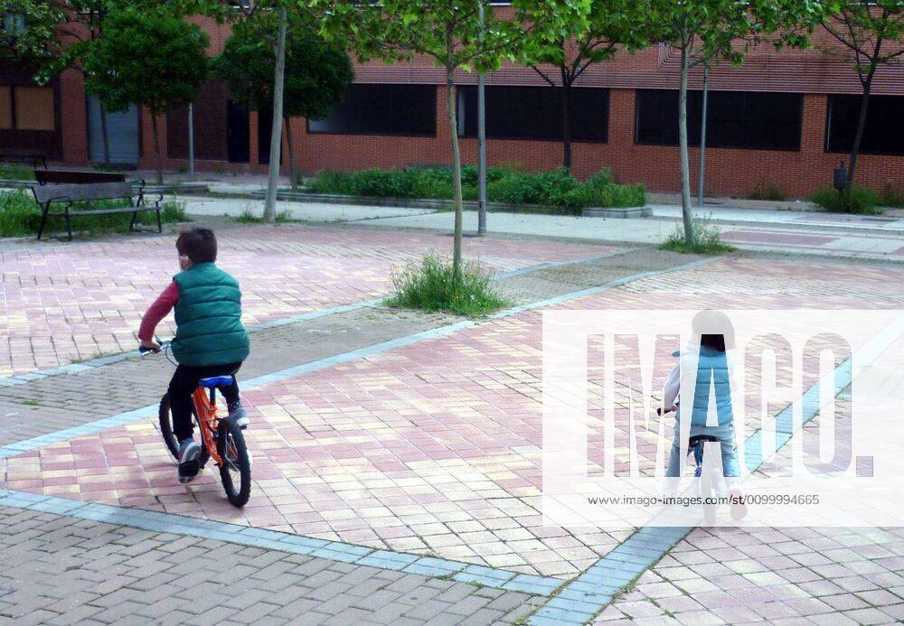 A family walks past the Madrid Street after restrictions were partially lifted for children for the first time in six weeks, during the coronavirus disease COVID 19 outbreak in Madrid, Spain, April 26, Cordon Press