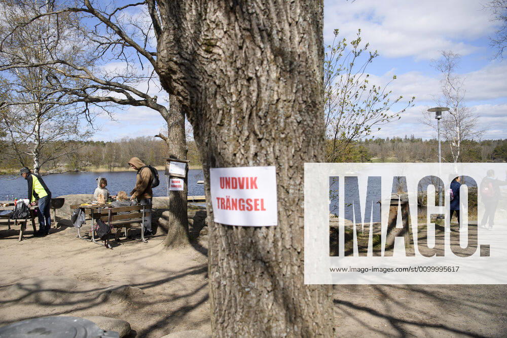 A sign on a tree saying Avoid congestion at the popular recreational area Hellasgarden in the outskirts of Stockholm, Sweden April 26, 2020 during the on going coronavirus pandemic STOCKHOLM SWEDEN