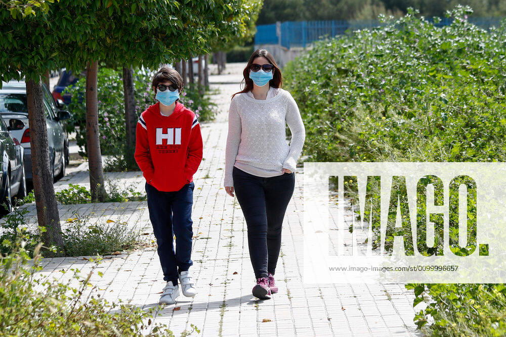 A woman and her son leave the home on the first day of relaxation of the confinement measures marked by the Government of Spain during the State of Alarm caused by the Covid-19 Pandemic on April 26, 2020 in Valdemoro, Madrid, Spain Valdemoro SPAIN - ZUMAa181 20200426_zaa_a181_003