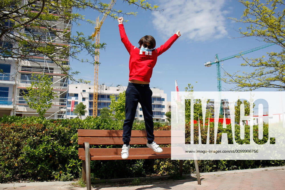 A child jumps on the first day of relaxation of the confinement measures marked by the Government of Spain during the State of Alarm caused by the Covid-19 Pandemic on April 26, 2020 in Valdemoro, Madrid, Spain Valdemoro SPAIN - ZUMAa181 20200426_zaa_a181_023