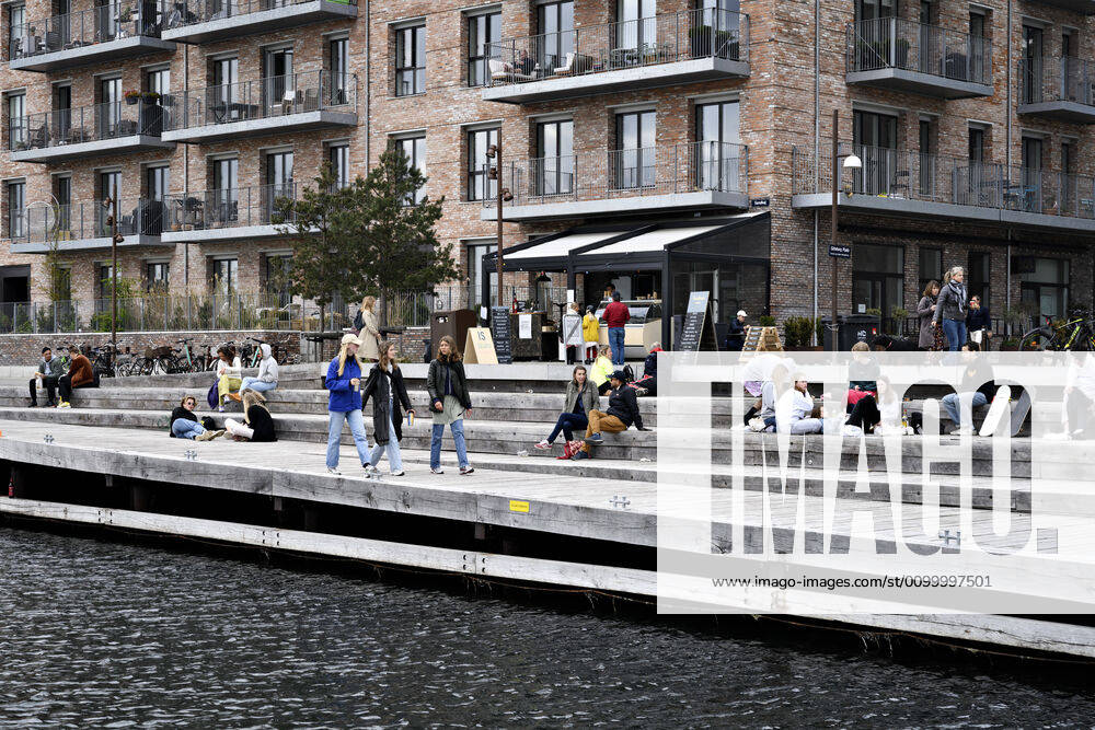The Copenhageners enjoy the spring sun at Gothenburg Square and Sandkaj in Nordhavnen in Copenhagen on Sunday, April 26, 2020 There is a ban on more than ten people because of the danger of contagion with coronavirus covid 19 perceived less than it really is , Copenhagen Denmark,
