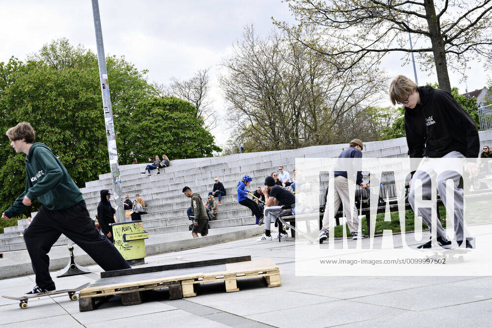 The Copenhageners enjoy the spring sun at Israels Square in Copenhagen on Sunday, April 26, 2020 There is a ban on more than ten people because of the danger of infection with coronavirus covid 19 NOTE really is , Copenhagen Denmark,