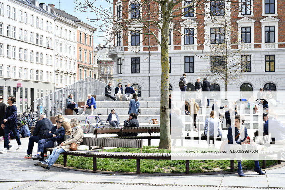 The Copenhageners enjoy the spring sun at Israels Square in Copenhagen on Sunday, April 26, 2020 There is a ban on more than ten people because of the danger of infection with coronavirus covid 19 NOTE really is , Copenhagen Denmark,