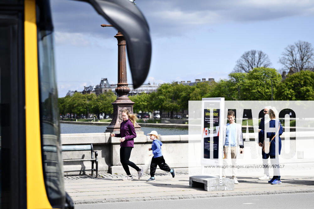 Copenhageners enjoy spring sun on Queen Louises Bridge in Copenhagen on Sunday, April 26, 2020 There is a ban on assembly of over ten people because of the danger of infection with coronavirus covid 19, Copenhagen Denmark,