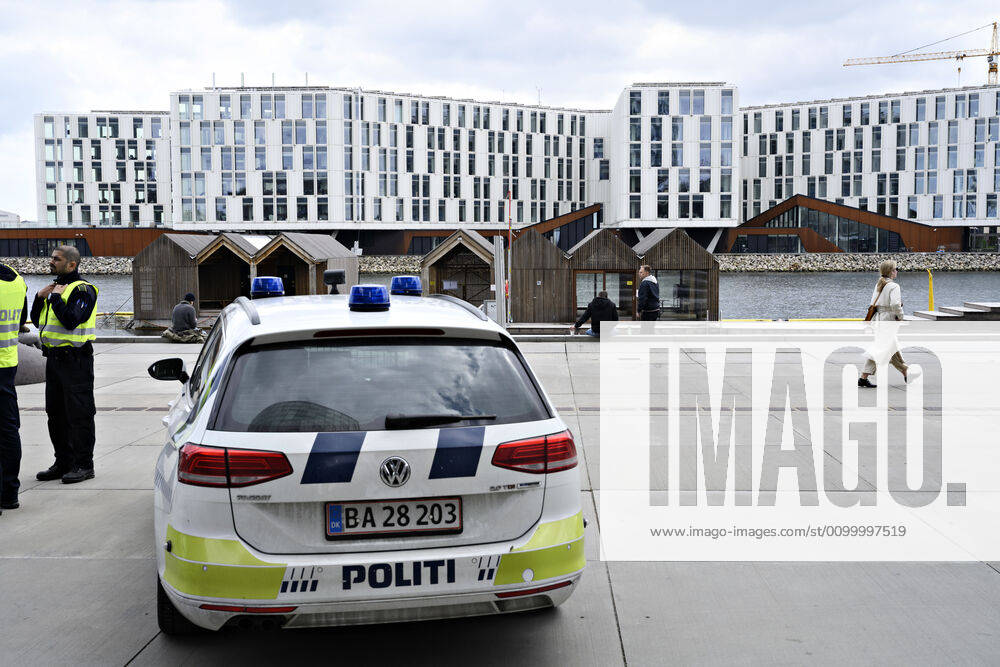 Police patrol while Copenhageners enjoy spring sun at Gothenburg Plads and Sandkaj in Nordhavnen in Copenhagen on Sunday, April 26, 2020 There is a ban on more than ten people because of the danger of infection with coronavirus covid 19, Copenhagen Denmark,
